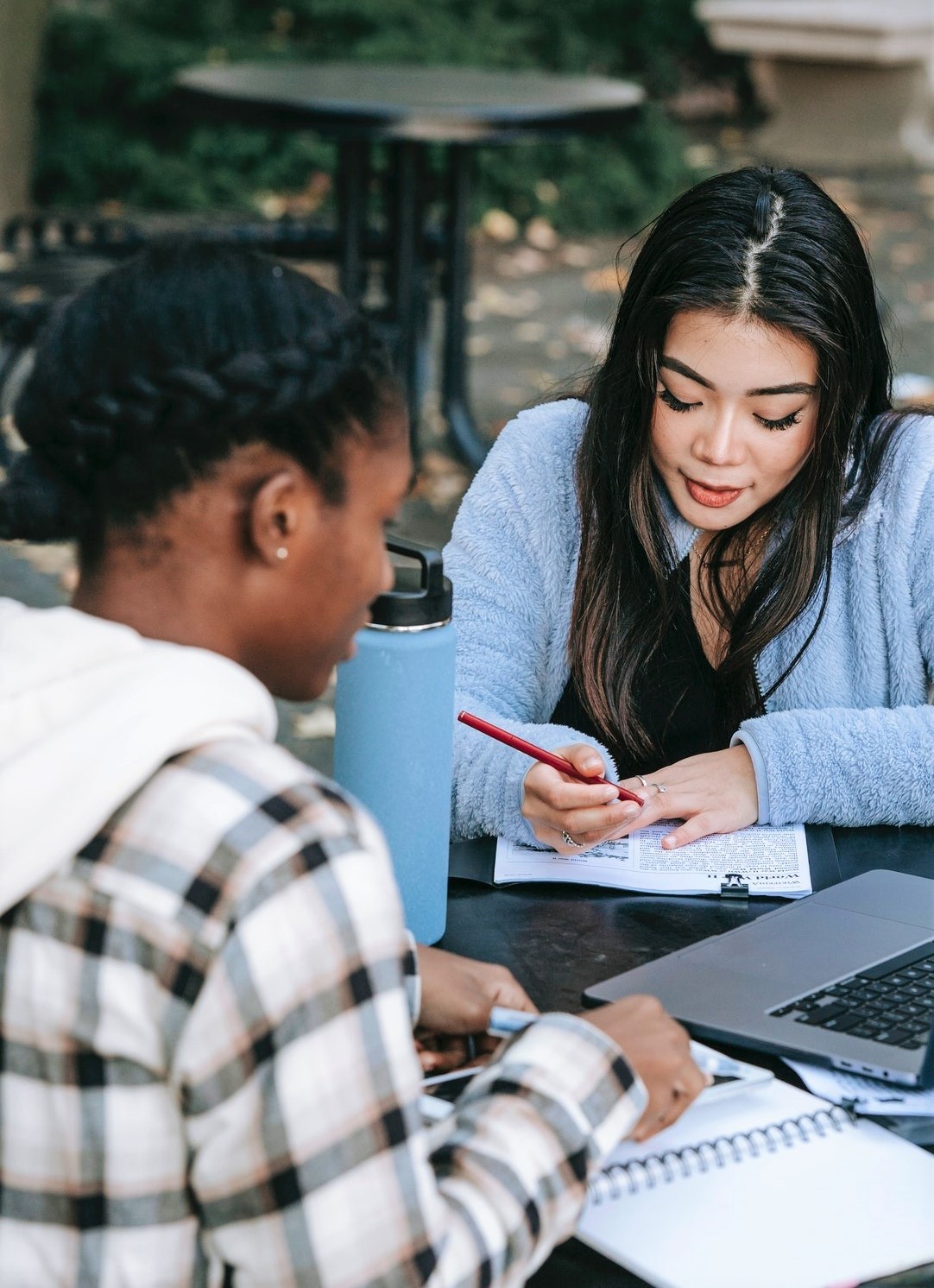 student conversing with school counselor