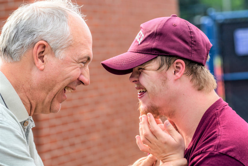 special ed teacher smiling with student